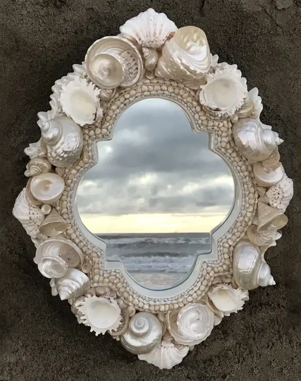 white-shell-mirror-on-sand